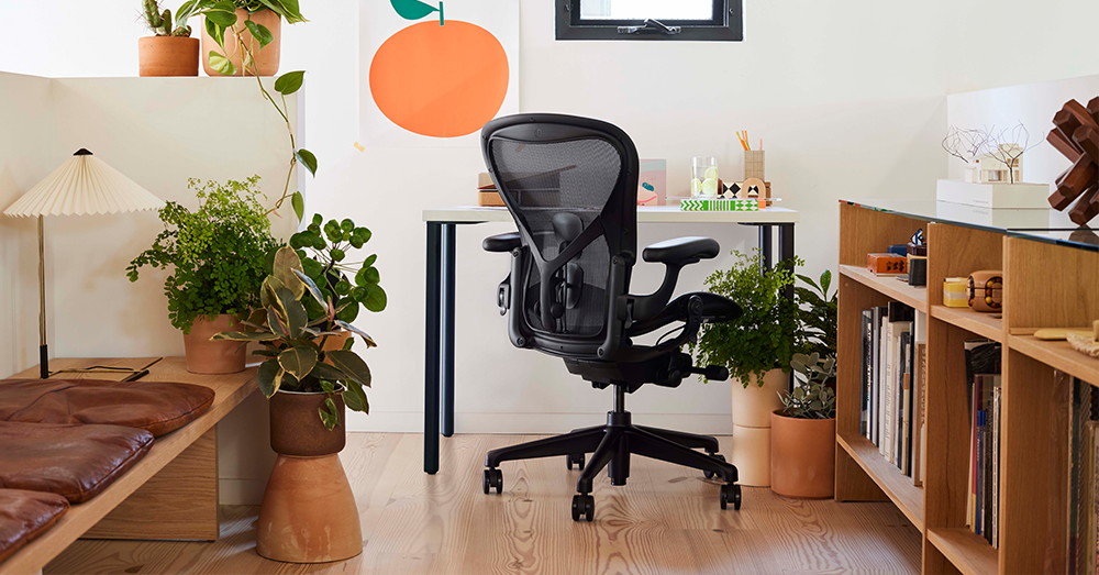 A blue Cosm in a home office environment