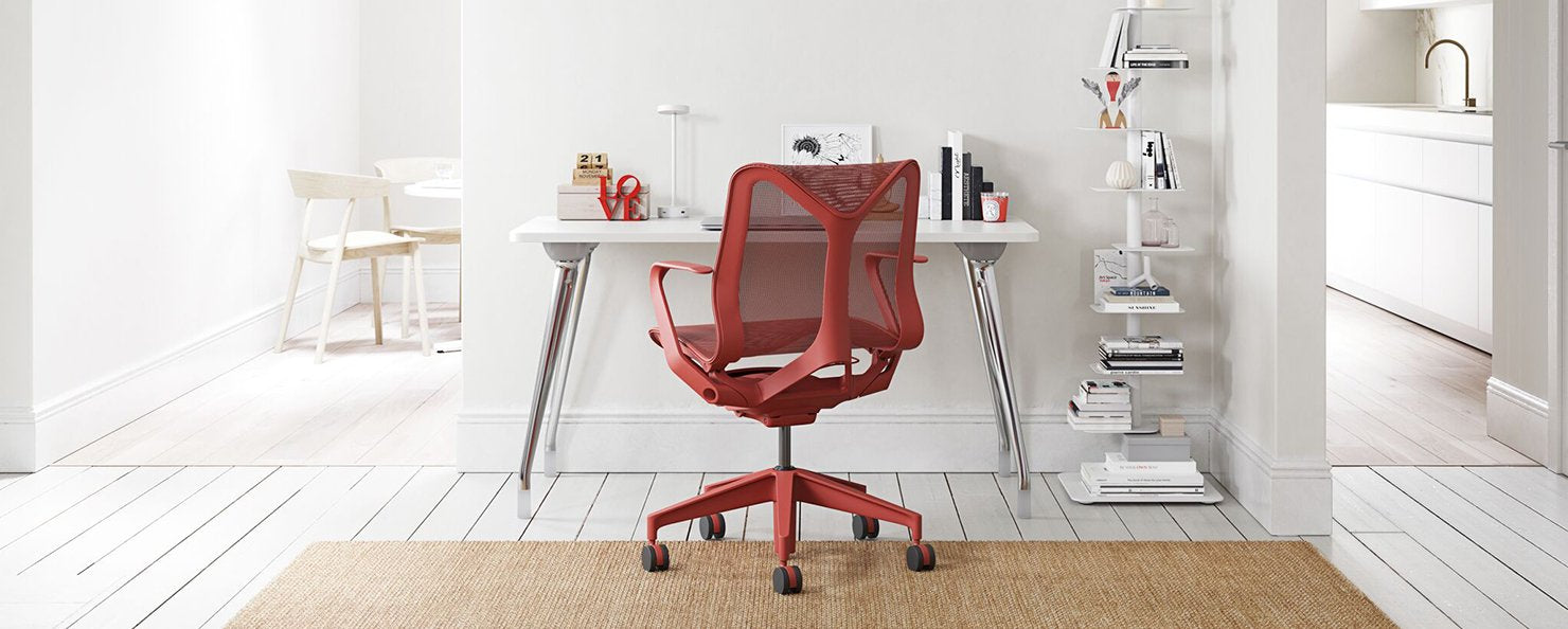 A red Cosm chair at an AbakEnvironments desk
