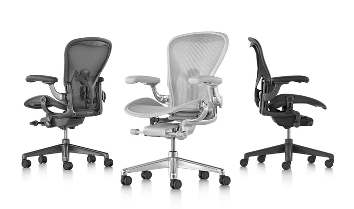 Three Aeron office chairs in mineral, graphite and carbon