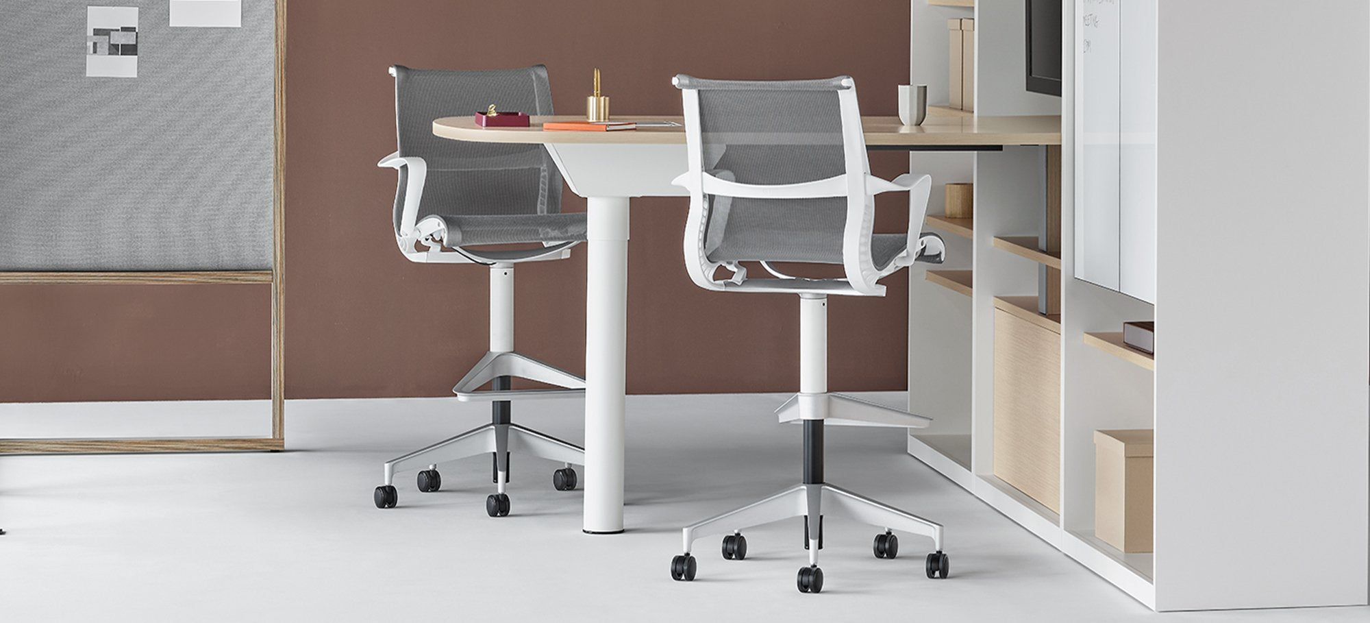 Two grey Setu Stools at a meeting space