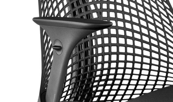 Close up view of the seat and arms on a black Sayl chair